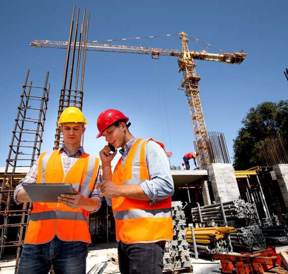 Crew reviewing plans on site