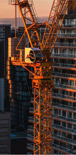 Tower crane beside high-rise