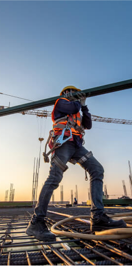 Engineer reviewing blueprints